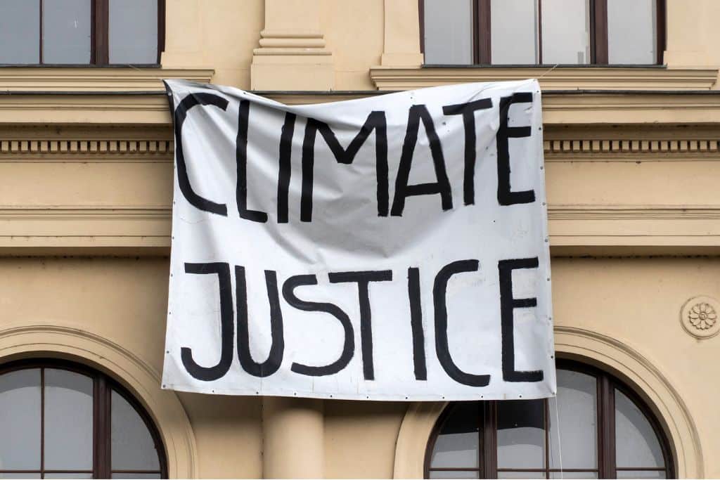A protest sign reading "Climate justice"