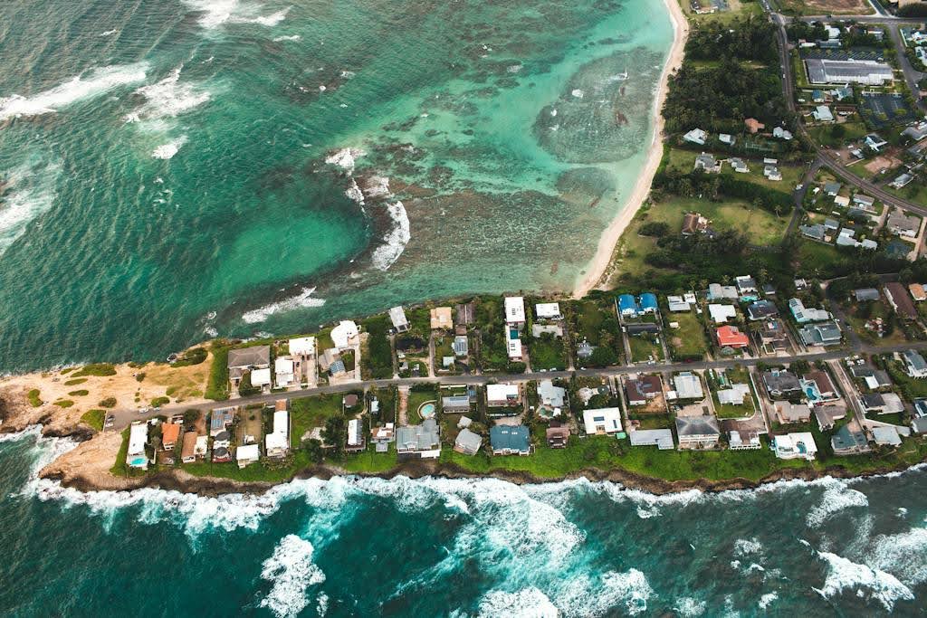 Coastal communities are especially vulnerable to the effects of climate change and extreme weather, including storm surges, flooding, and erosion, prompting developers and residents alike to seek innovative ways to adapt. Wikimedia Commons