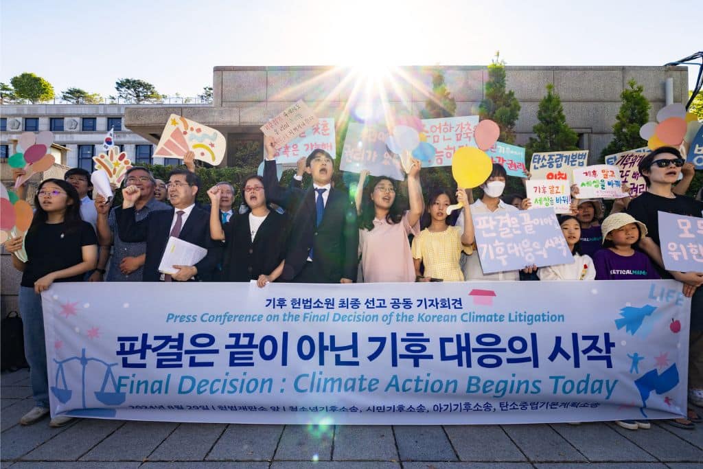 Young activists and Attorney Sejong Youn (middle) celebrating the Korean Constitutional Court's verdict on August 29, 2024